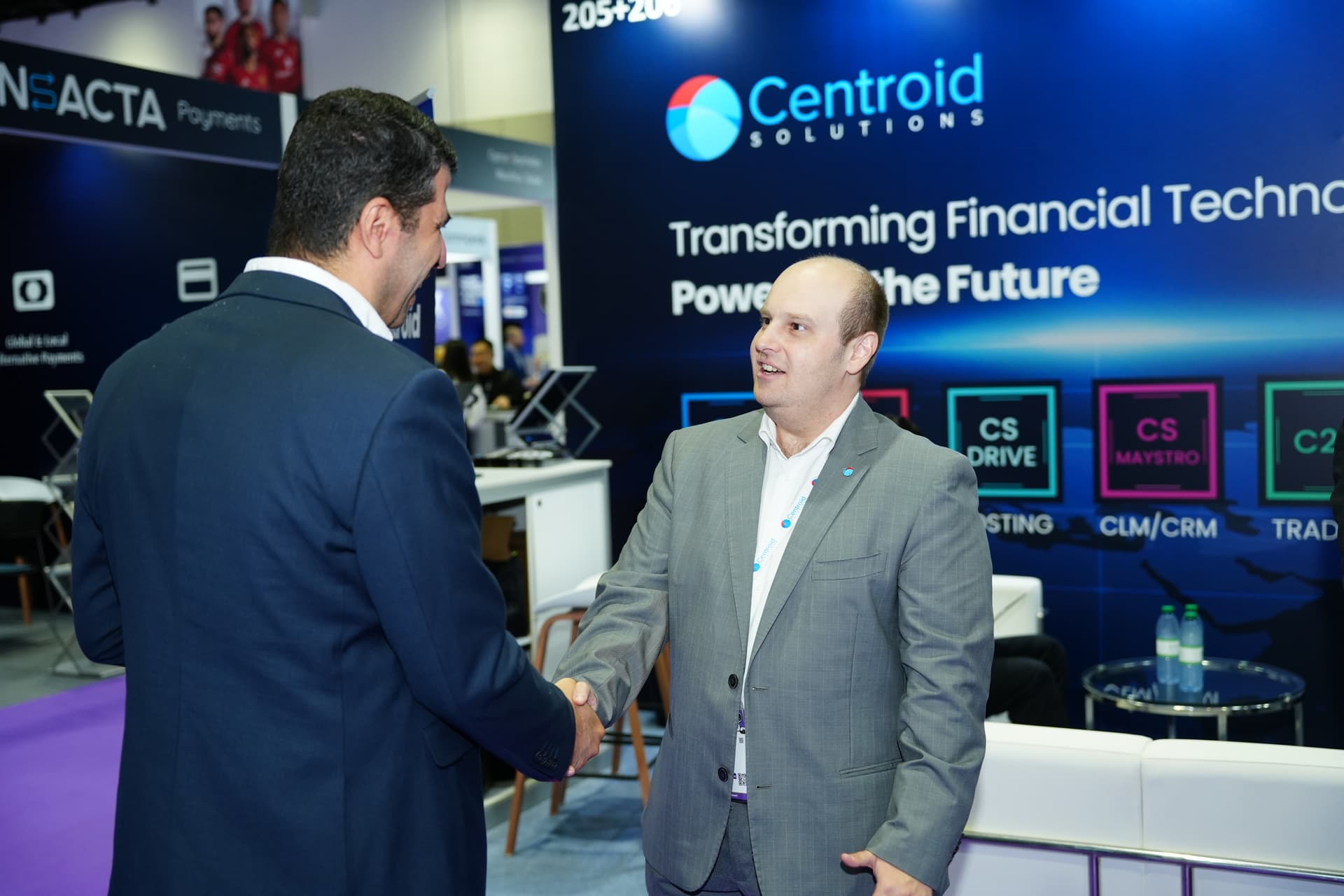 Visitors at a live product demonstration on the Centroid booth